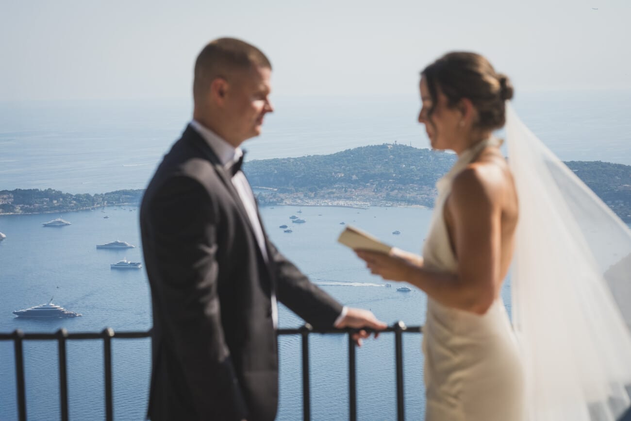 An Intimate French Riviera Elopement at Château Eza: An Afternoon Love Story 7 Intimate Elopement ceremony exchanging vows overlooking the French Riviera coastline from Chateau Eza