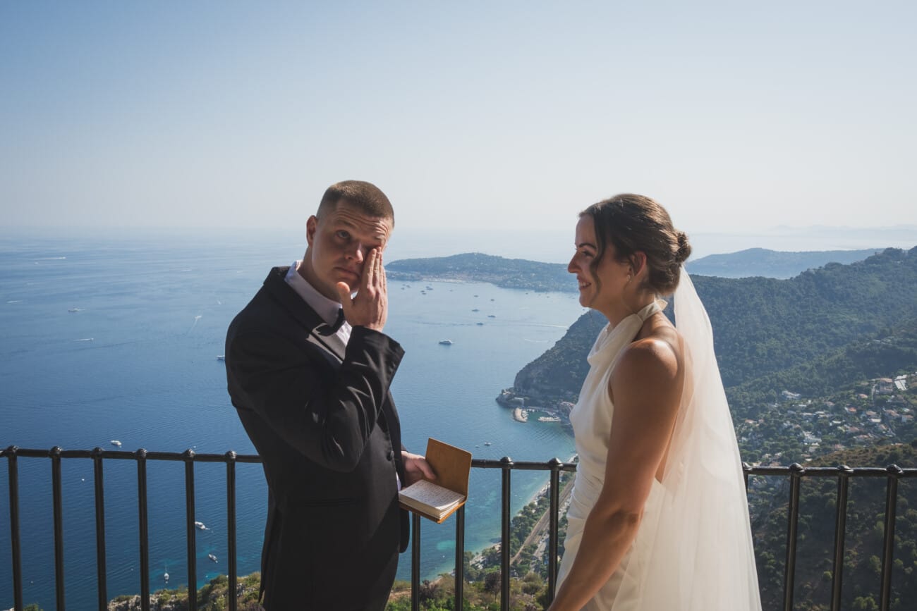 An Intimate French Riviera Elopement at Château Eza: An Afternoon Love Story 8 Tears of Joy during their vows echange overlooking the French Riviera coastline during their intimate elopement