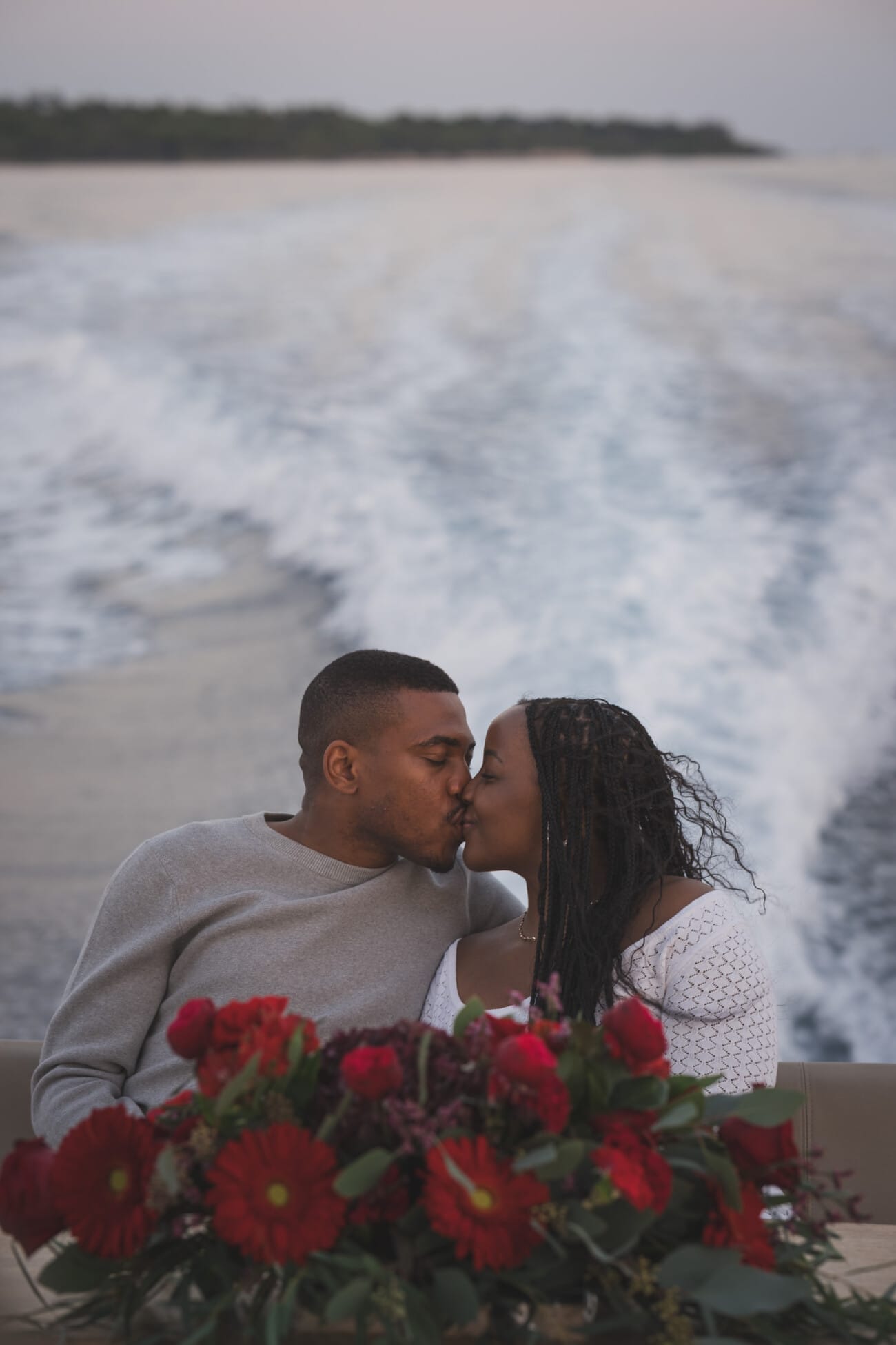 A Romantic Proposal on a Yacht between the Lérins Islands 25 Couple on yacht with floral arrangement.
after an intimate French Riviera Yacht proposal near Cannes.
Planning and Photography by WildRoses Studio.