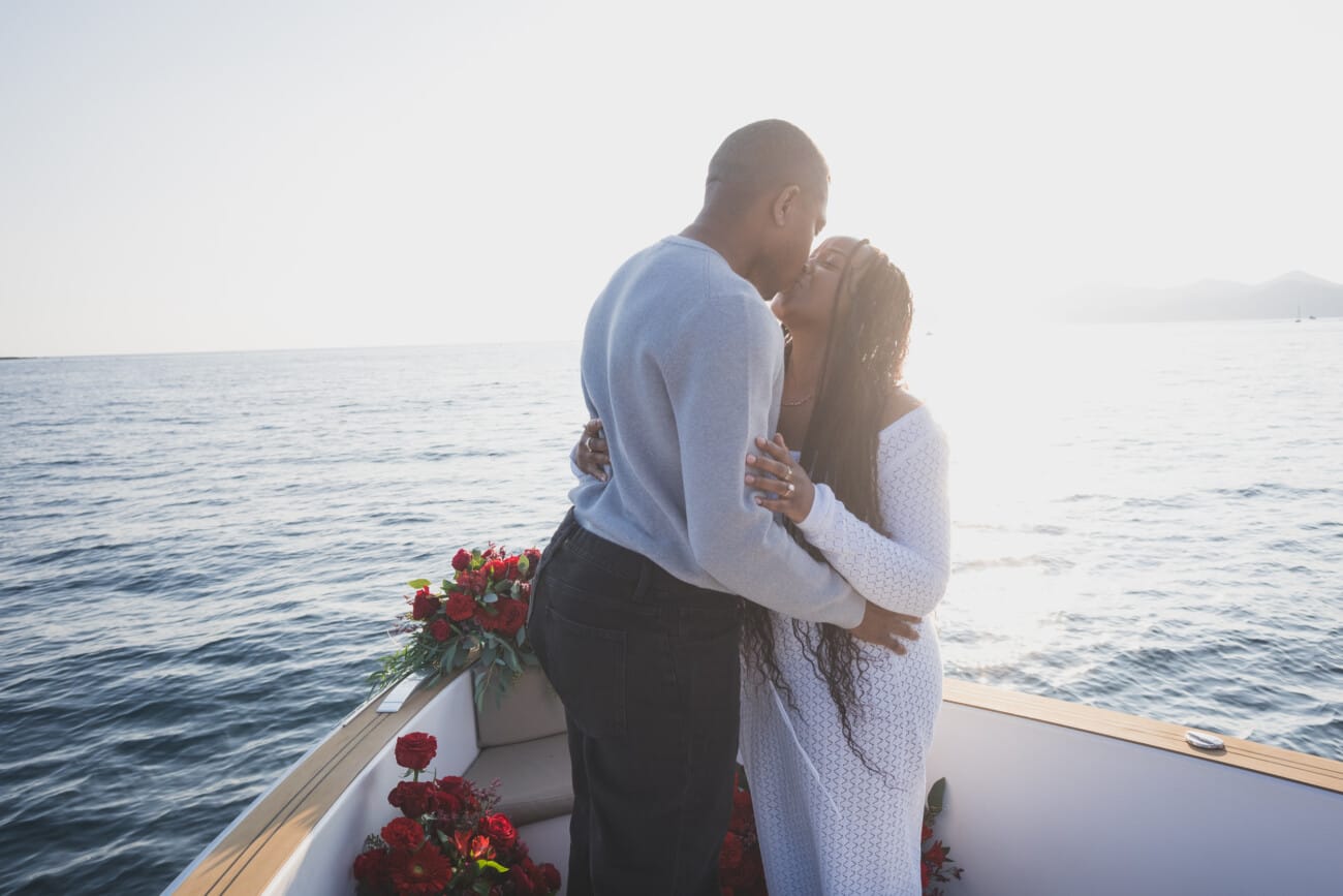 A Romantic Proposal on a Yacht between the Lérins Islands 10 First Kiss as an fiancés after their engagement on a Yacht.
French Riviera Proposal planning and Photography WildRoses Studio