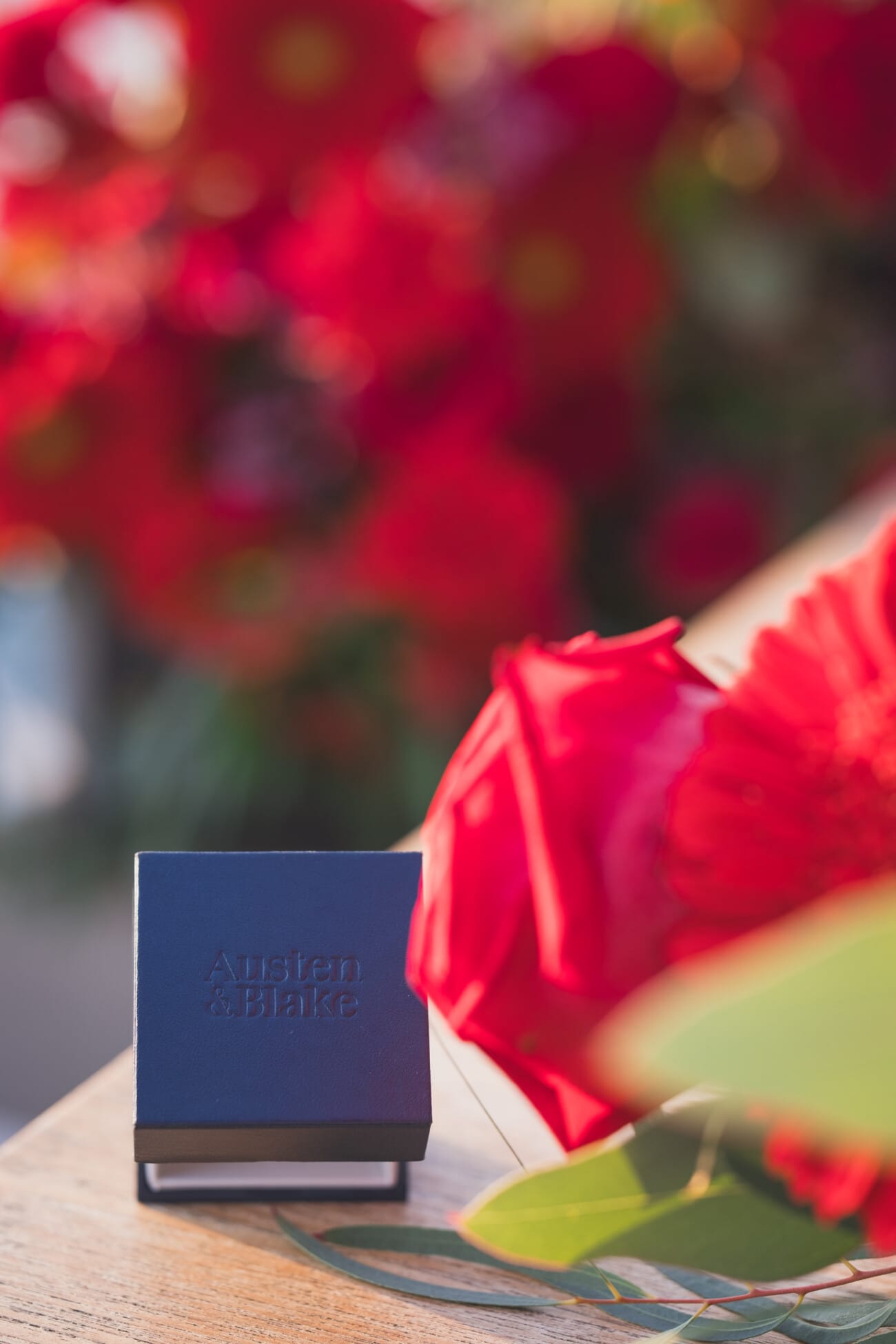A Romantic Proposal on a Yacht between the Lérins Islands 17 Engagement ring box with red flowers
French Riviera Proposal planning and Photography WildRoses Studio