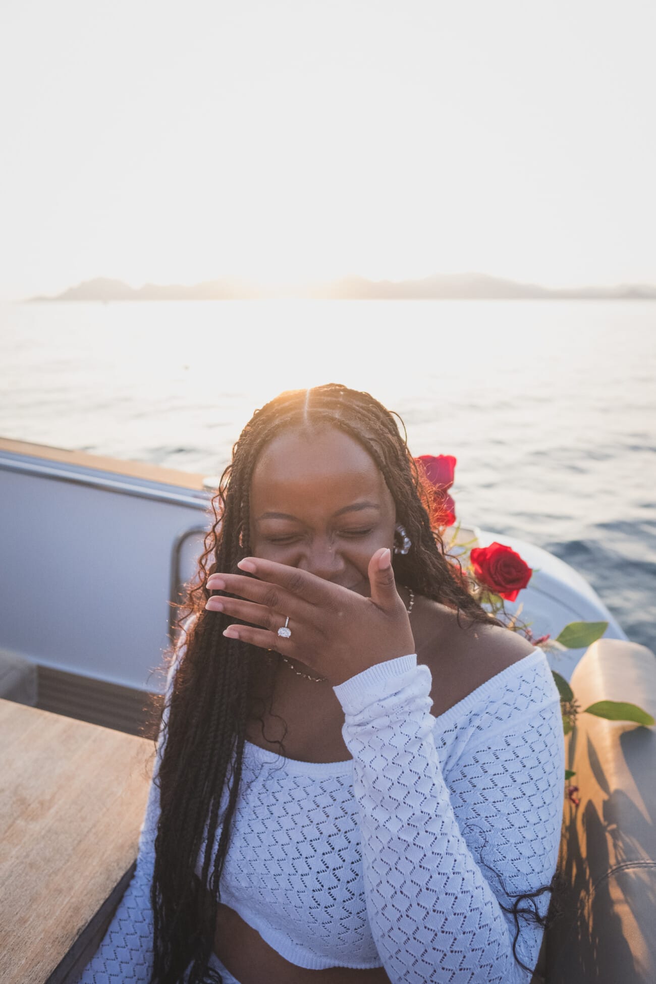 A Romantic Proposal on a Yacht between the Lérins Islands 22 Woman on yacht with roses, after her intimate French Riviera Yacht proposal near Cannes.
Planning and Photography by WildRoses Studio.