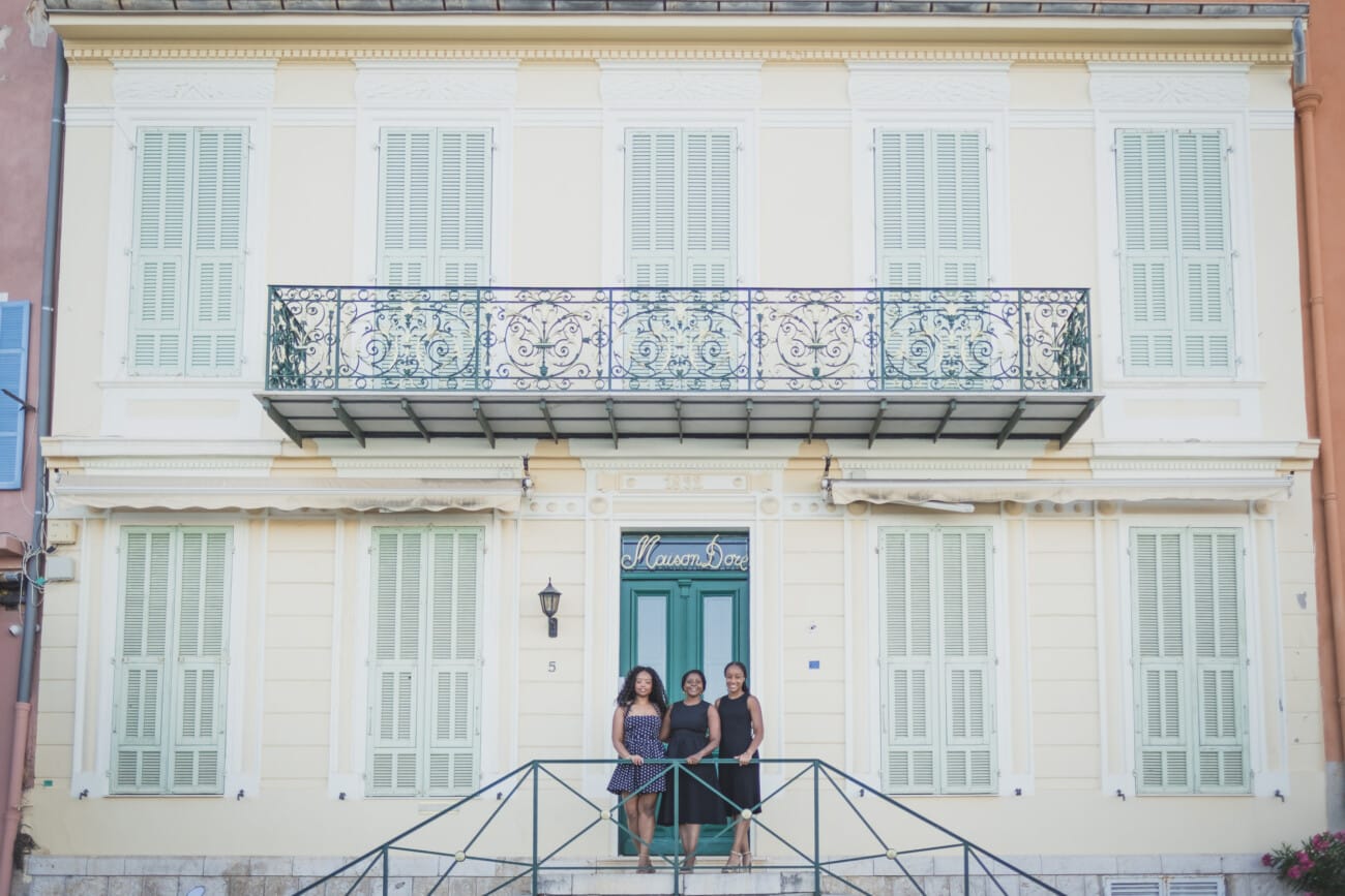 The Ultimate Girls’ Trip: A Mother and Daughters’ Legacy Session on the French Riviera 15 Detail shot of the three women’s hands joined together, symbolizing strong mother-daughter moments and memories.