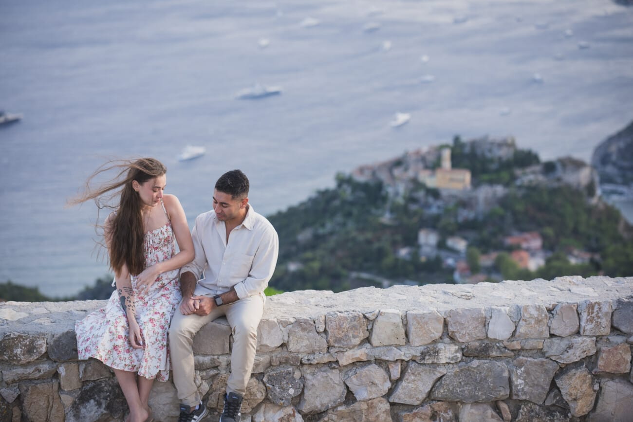 Wide shot of a French Riviera proposal capturing the dramatic scenery and wild nature surrounding the couple