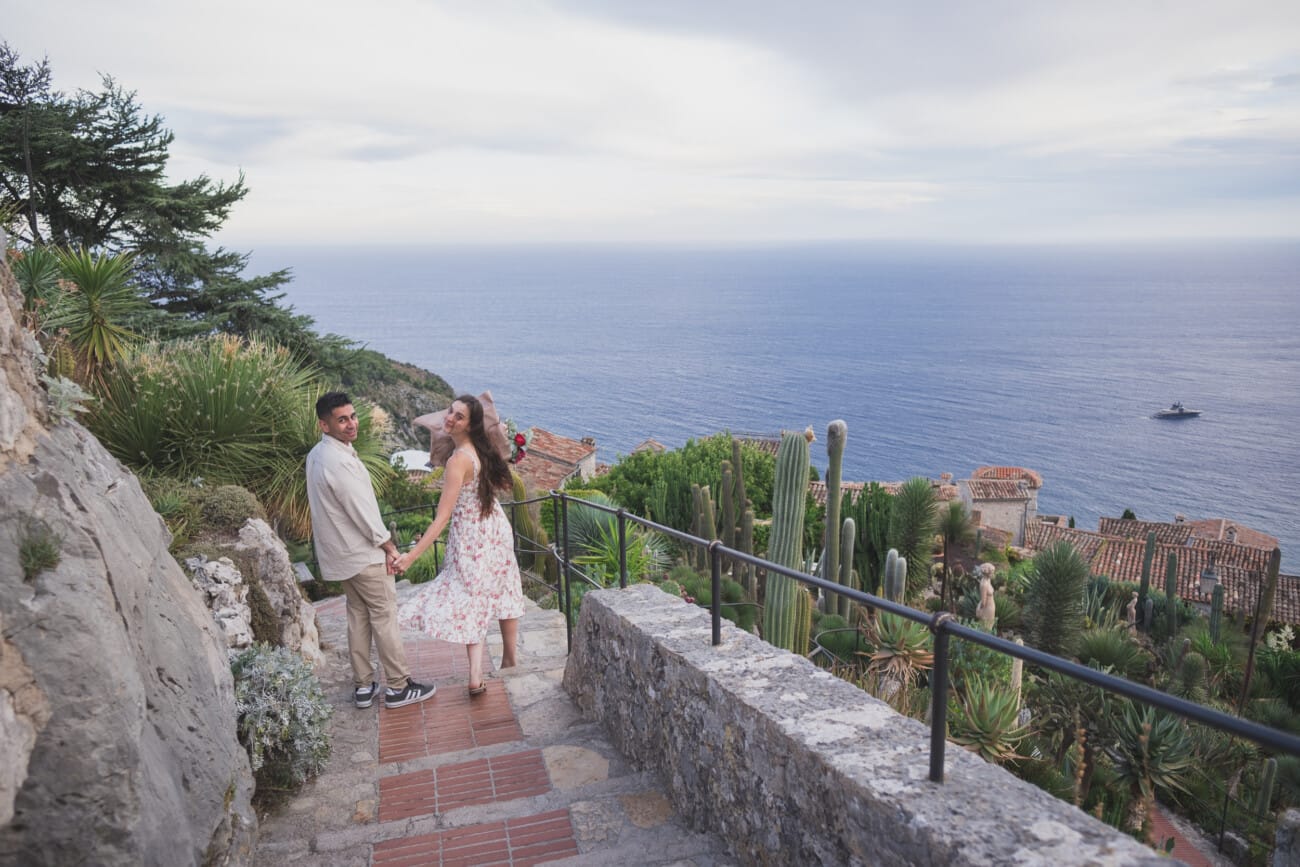 photo of the couple holding hands and walking away from the proposal spot.
