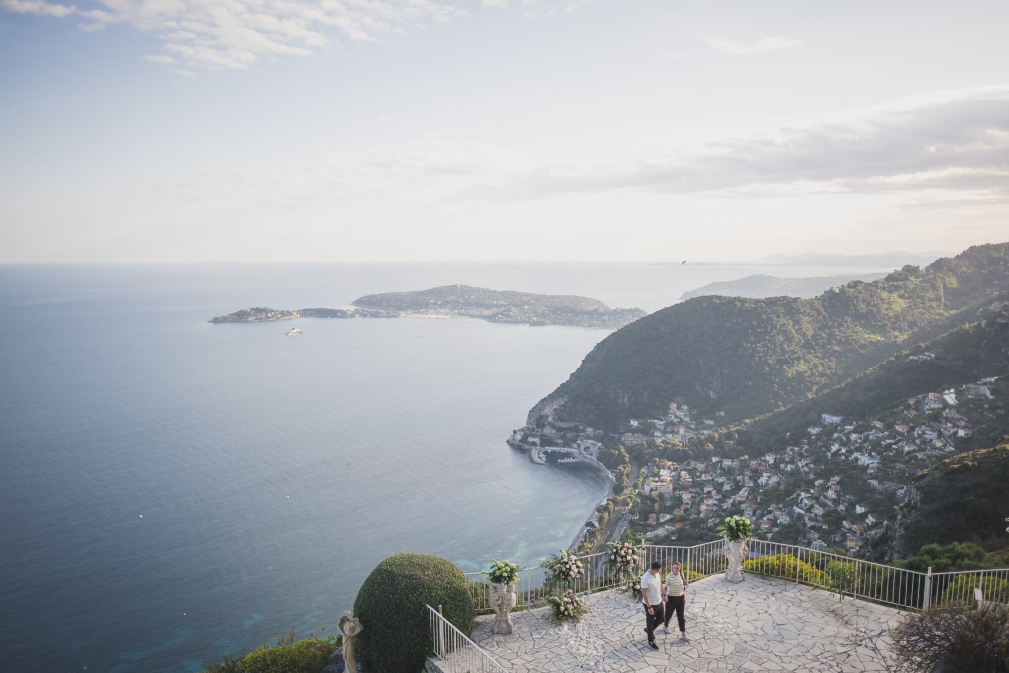 Eze Chateau Chevre d'or Proposal couple with French Riviera coastline view behind themProposal Planning & photography WildRoses